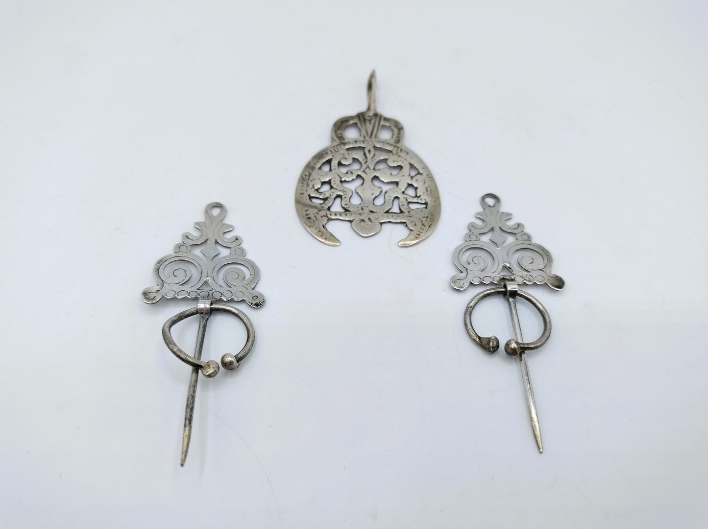 Silver Berber fibulas + pendant, Tunisia, 20th century