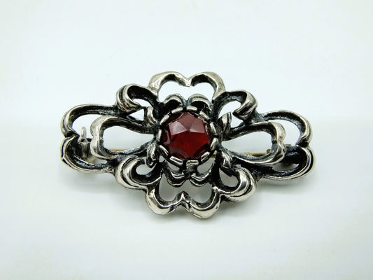 Silver vintage brooch with garnet, 835