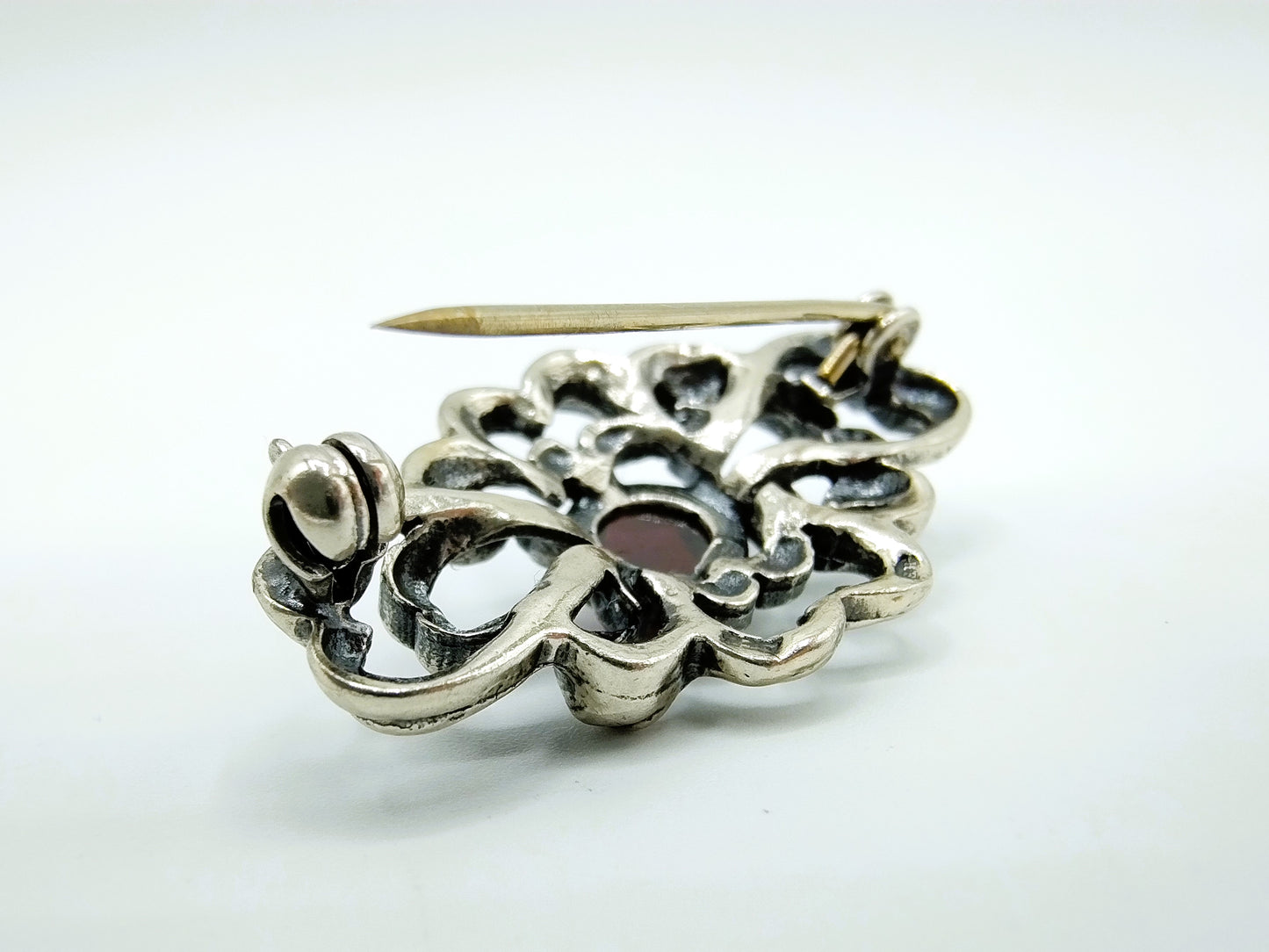 Silver vintage brooch with garnet, 835