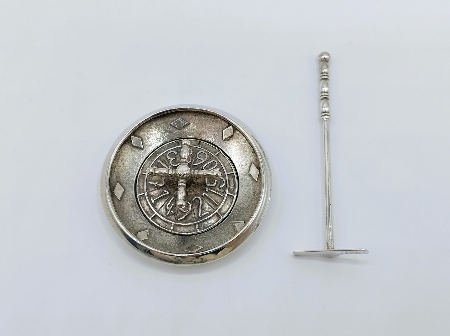 Silver roulette table with rotating centerpiece and stick, Amsterdam, 20th century