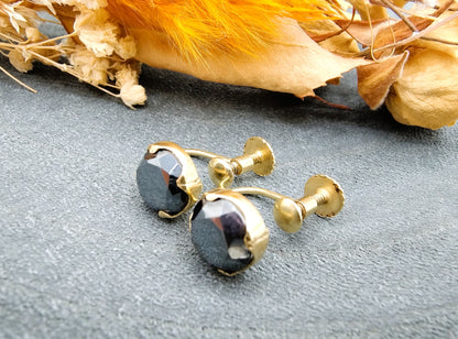 Gold screw earrings with black spinel