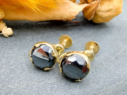 Gold screw earrings with black spinel