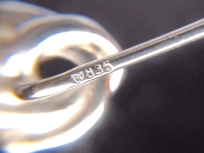 Zilveren reversspeld met knoop
