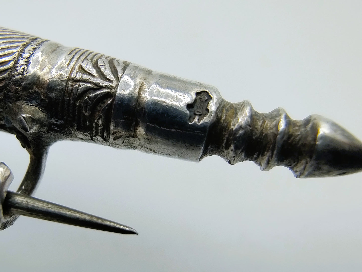 Silver brooch of knitting needle holder