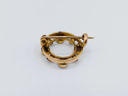 Gouden ringbroche met amethist en parels