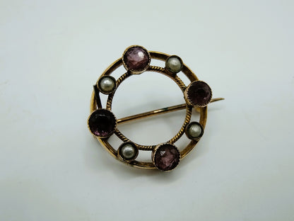 Gouden ringbroche met amethist en parels