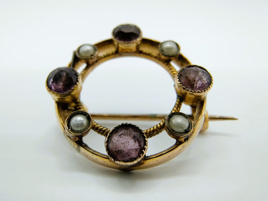 Gouden ringbroche met amethist en parels