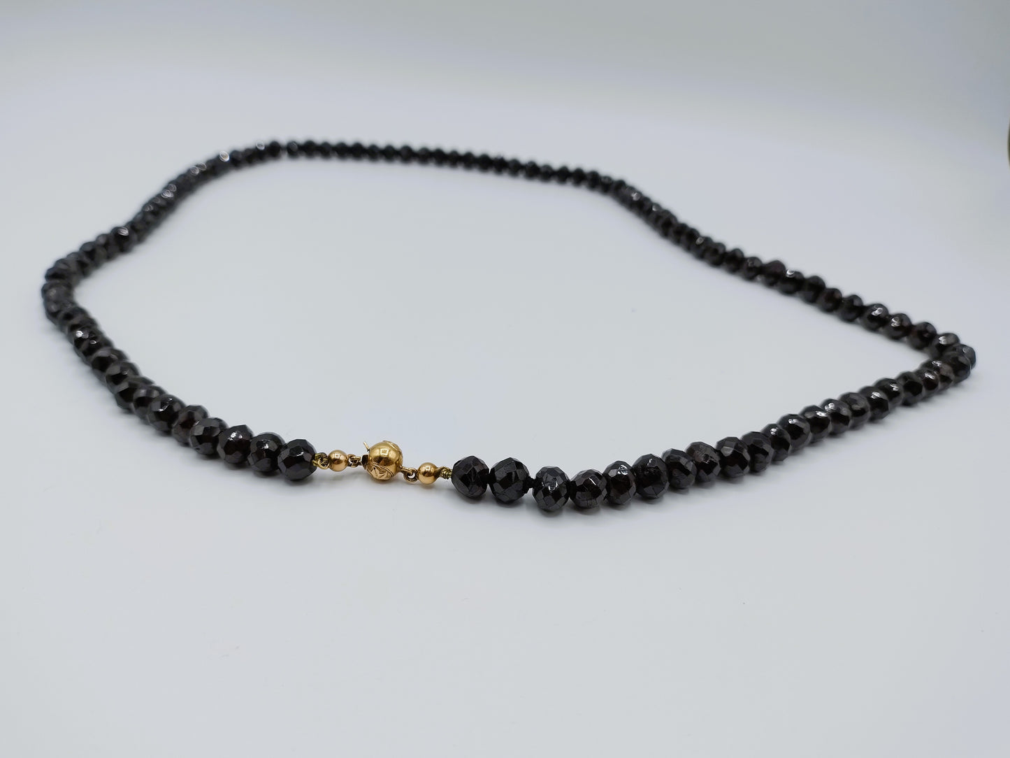 Garnet necklace with gold ball clasp, 72 cm