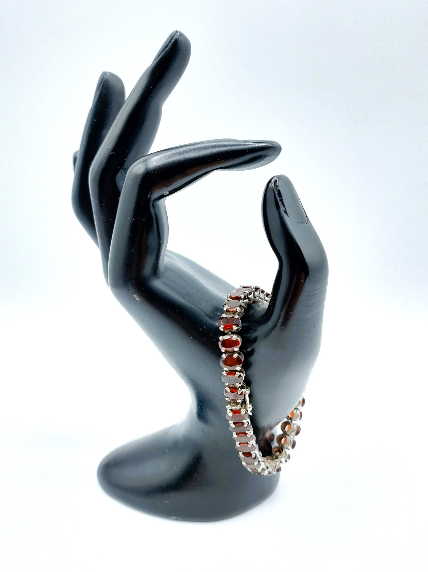 Silver tennis bracelet with red stones, 17.5 cm