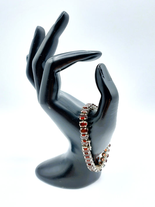 Silver tennis bracelet with red stones, 17.5 cm