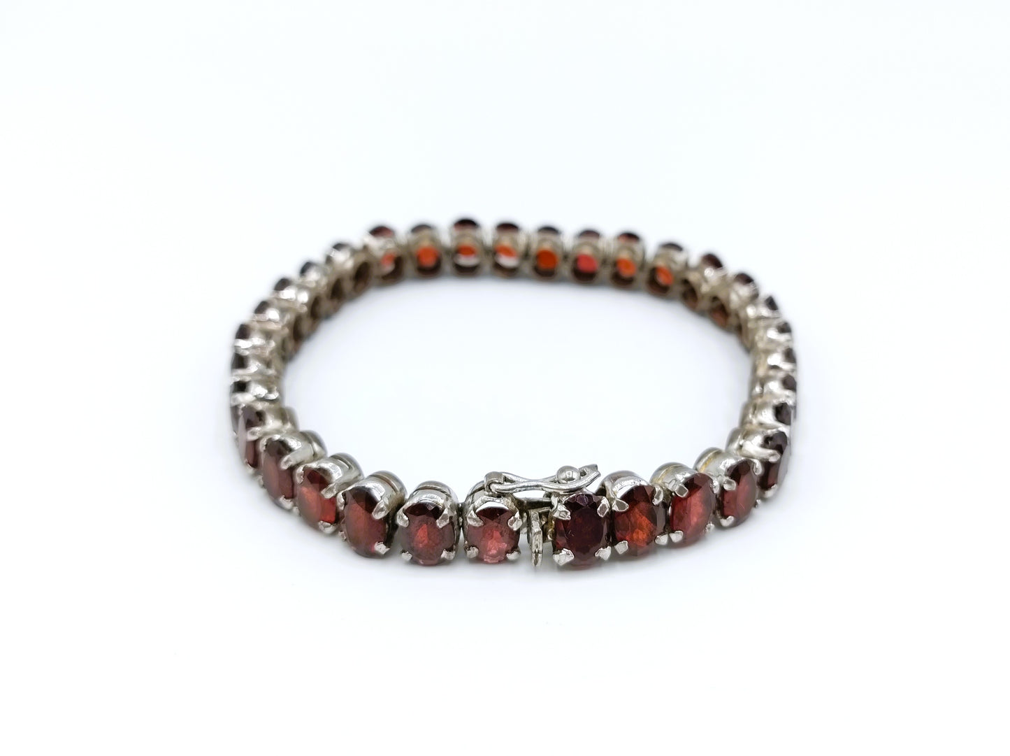 Silver tennis bracelet with red stones, 17.5 cm