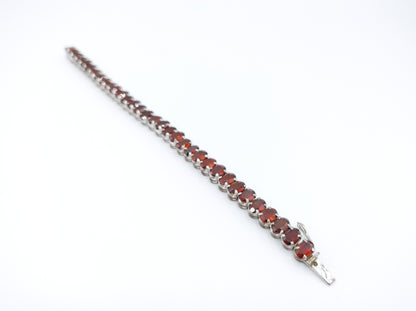 Silver tennis bracelet with red stones, 17.5 cm