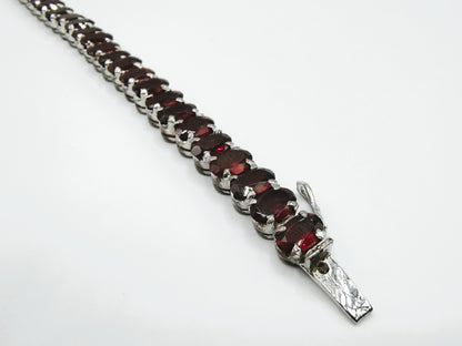 Silver tennis bracelet with red stones, 17.5 cm