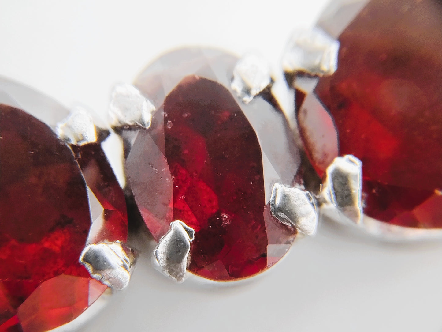 Silver tennis bracelet with red stones, 17.5 cm