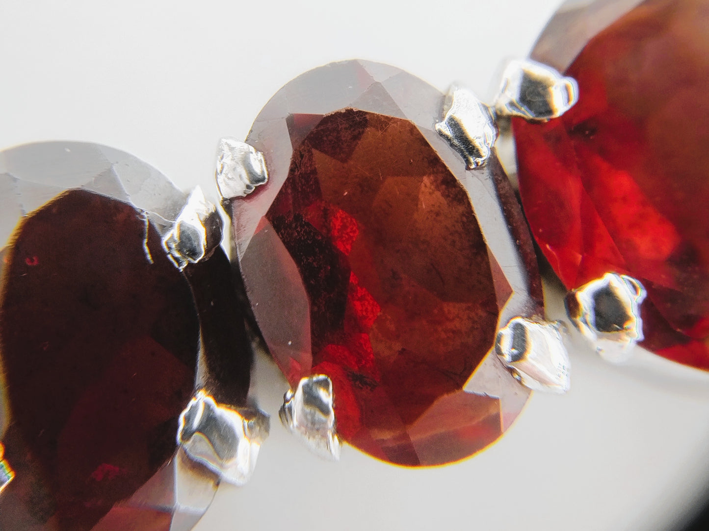 Silver tennis bracelet with red stones, 17.5 cm