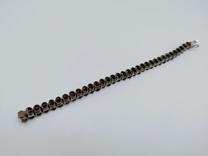 Silver tennis bracelet with red stones, 17.5 cm
