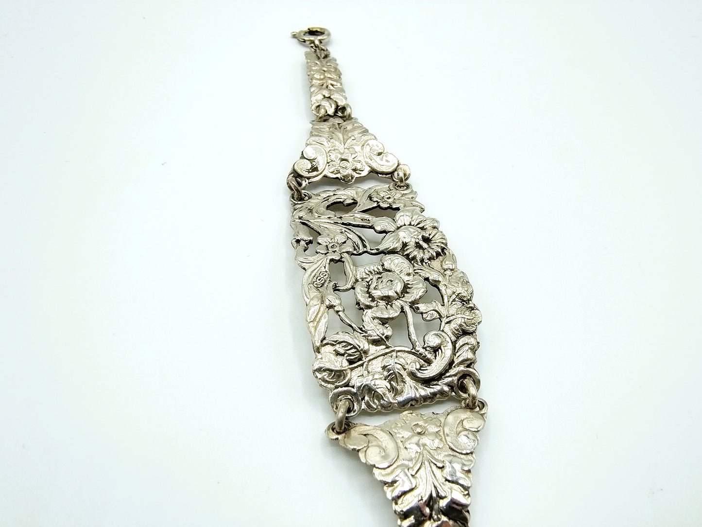 Zilveren schakelarmband met bloemmotieven, 17 cm