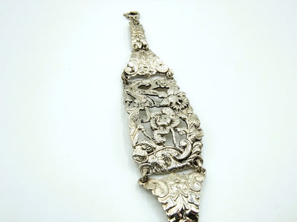 Zilveren schakelarmband met bloemmotieven, 17 cm