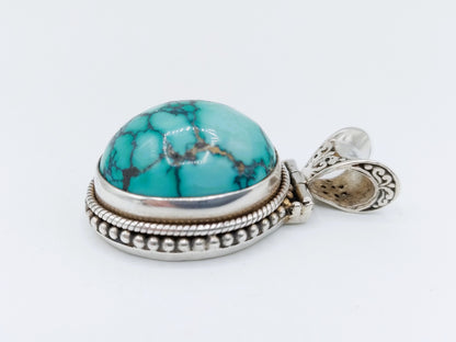 Robuuste zilveren hanger met een grote turkoois