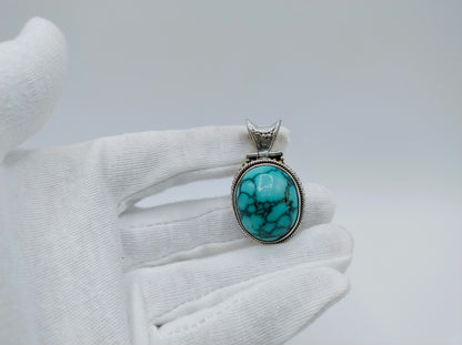 Robuuste zilveren hanger met een grote turkoois