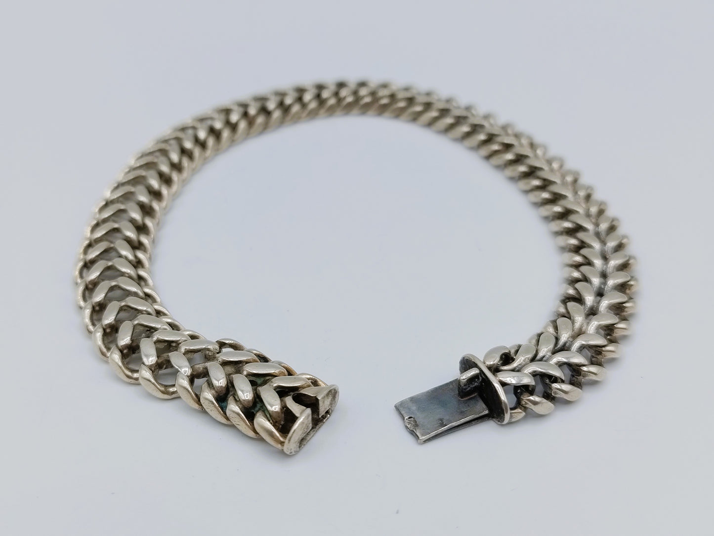 Zilveren heren schakelarmband, 24 cm.