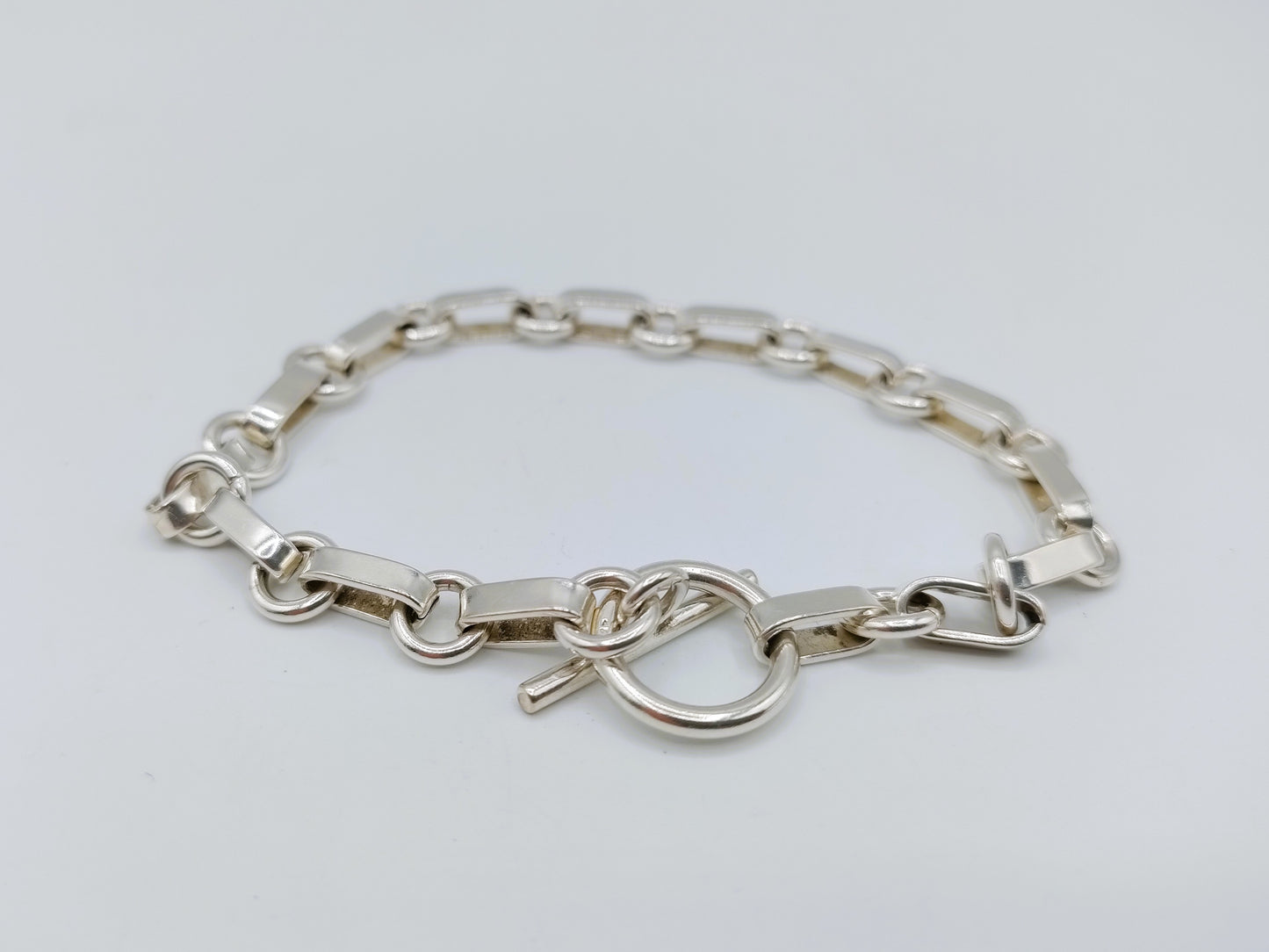 Zilveren schakelarmband met kapittelsluiting, 19 cm.