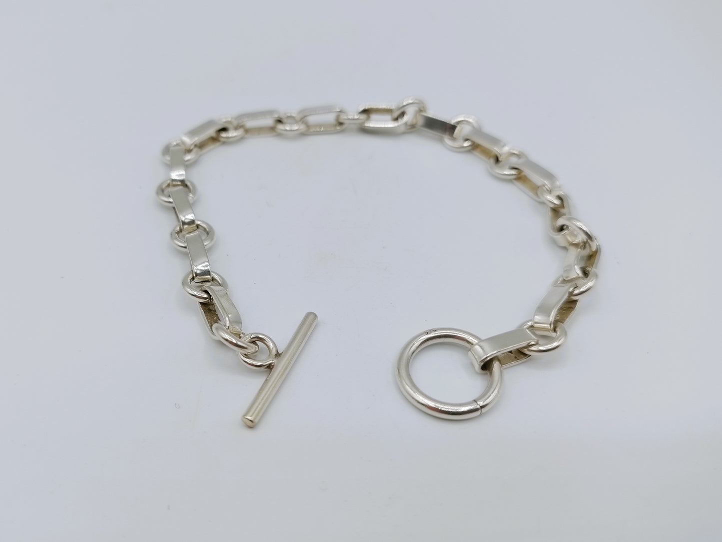 Zilveren schakelarmband met kapittelsluiting, 19 cm.