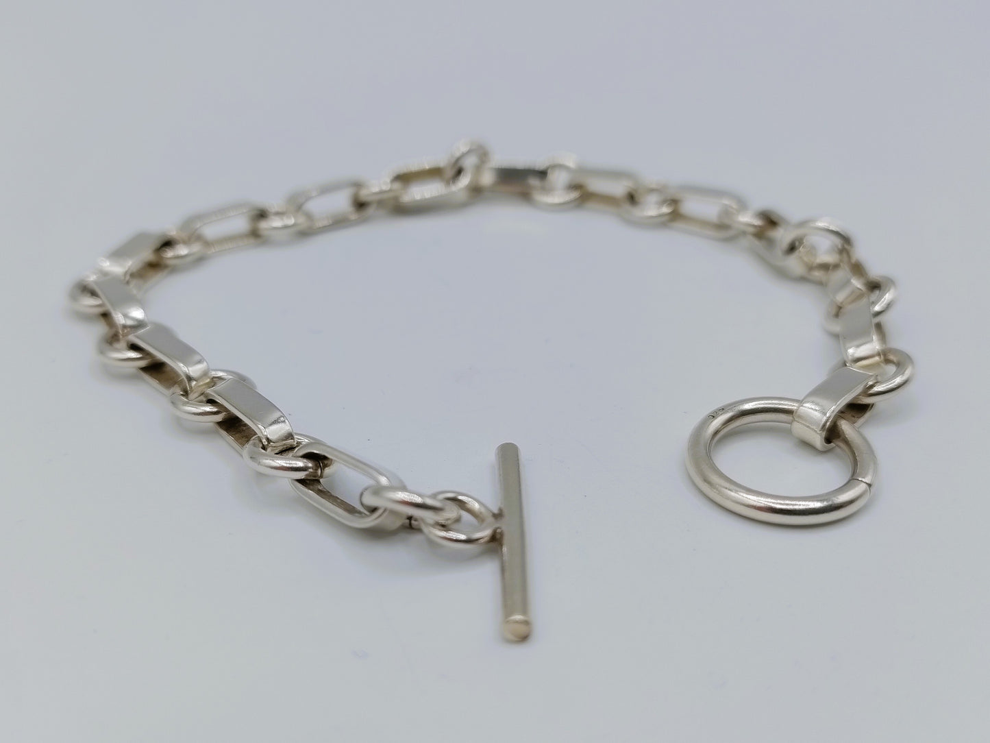 Zilveren schakelarmband met kapittelsluiting, 19 cm.