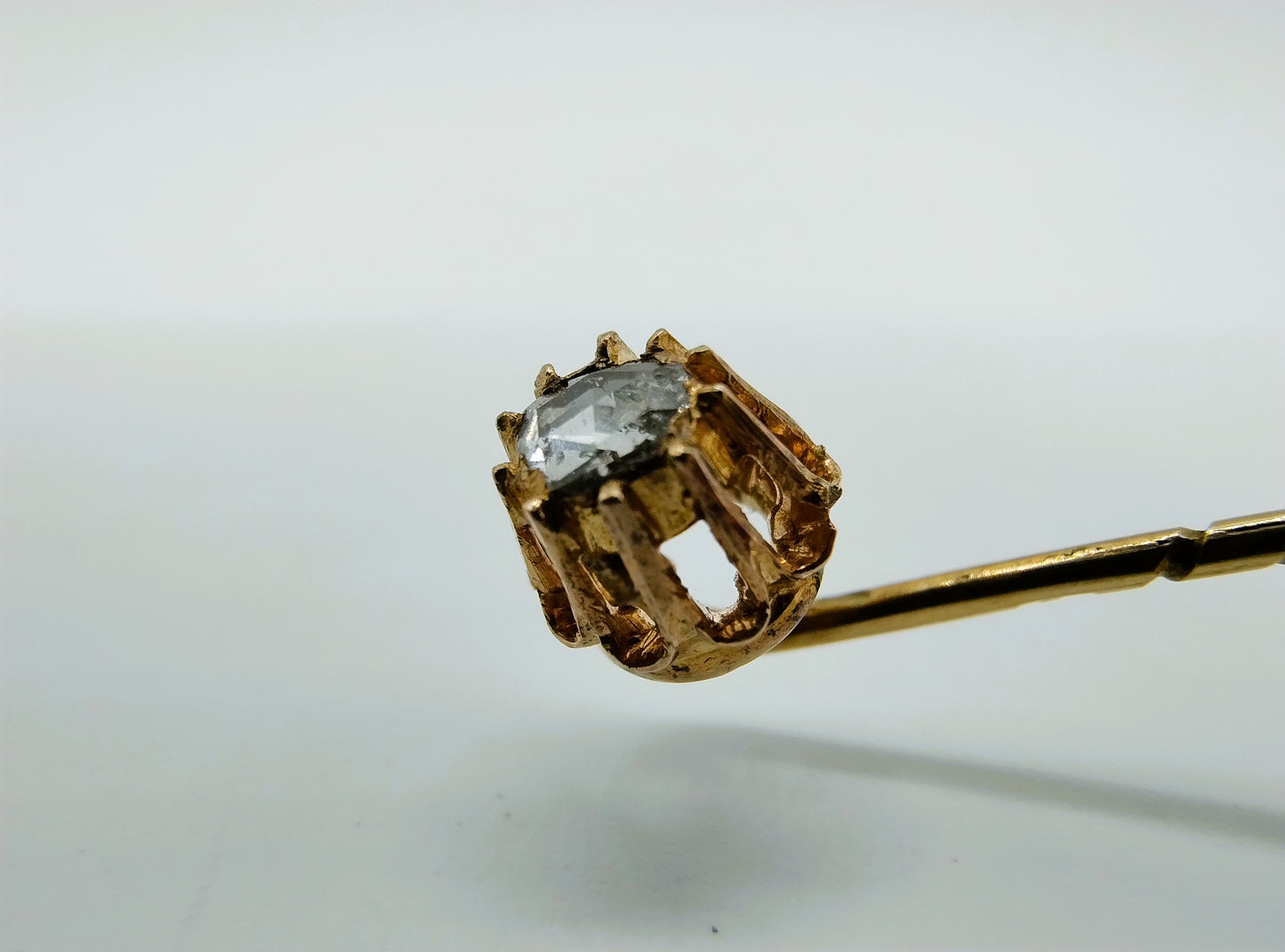 Gold tie or lapel pin with rose diamond