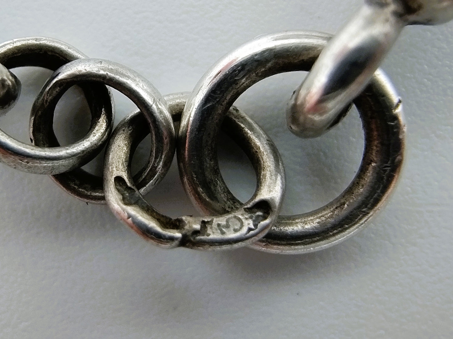 Silver pocket watch with watch chain and key