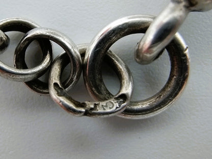 Silver pocket watch with watch chain and key
