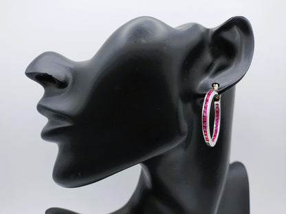 Silver hoop earrings with pink stones