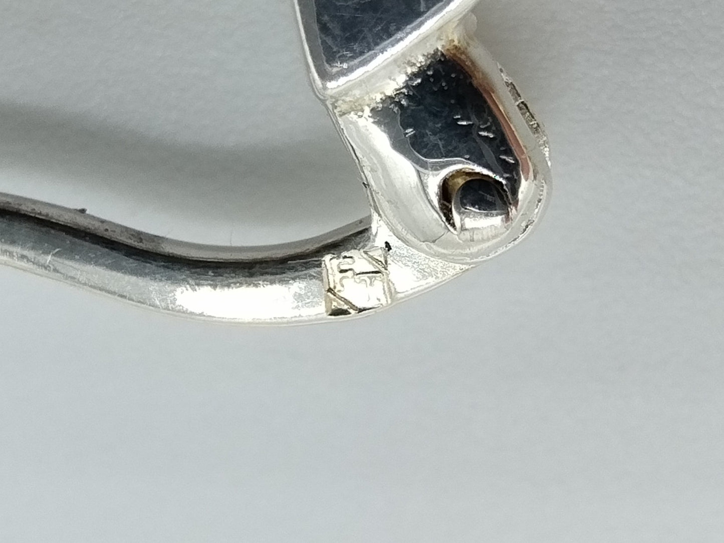 Silver hoop earrings with orange stones
