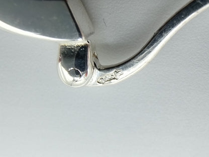 Silver hoop earrings with orange stones