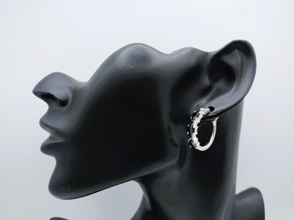 Silver hoop earrings with black stones