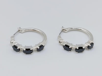Silver hoop earrings with black stones