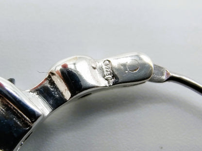 Silver hoop earrings with black stones