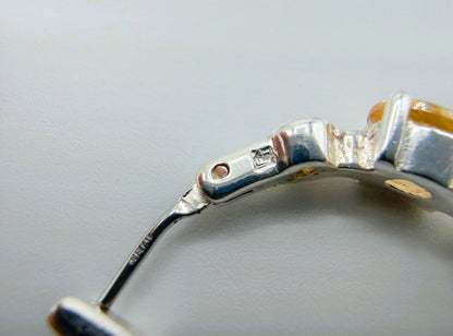 Silver hoop earrings with yellow stones