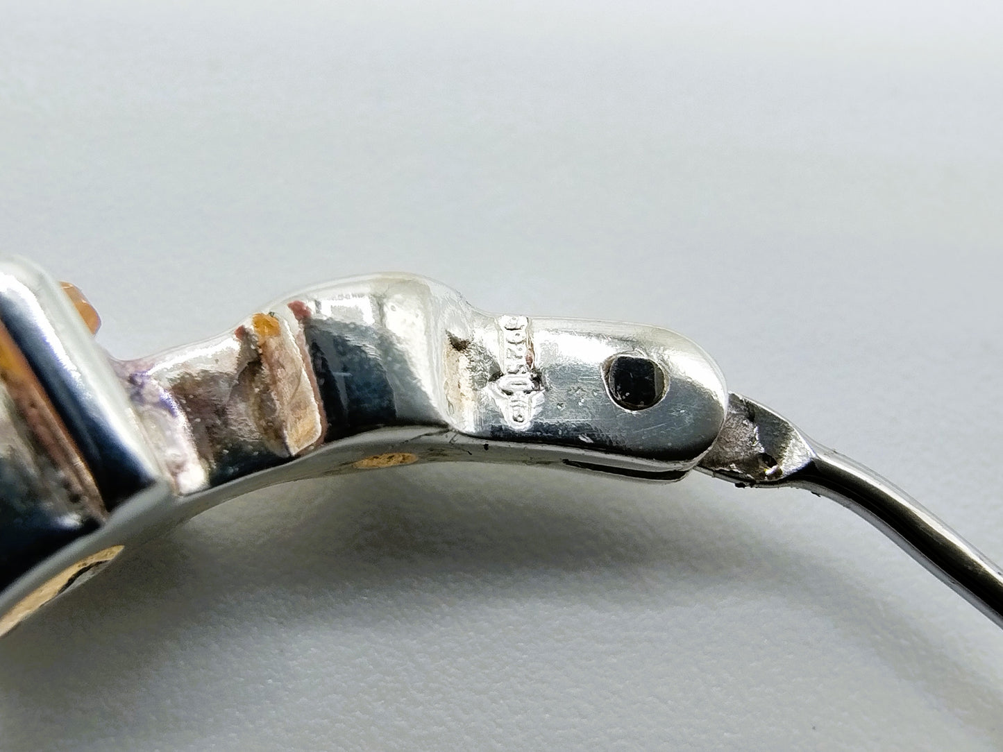 Silver hoop earrings with yellow stones