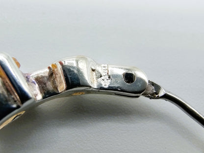 Silver hoop earrings with yellow stones