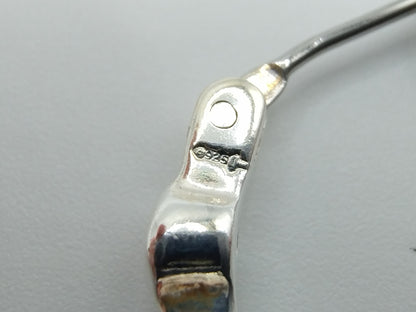 Silver hoop earrings with orange stones