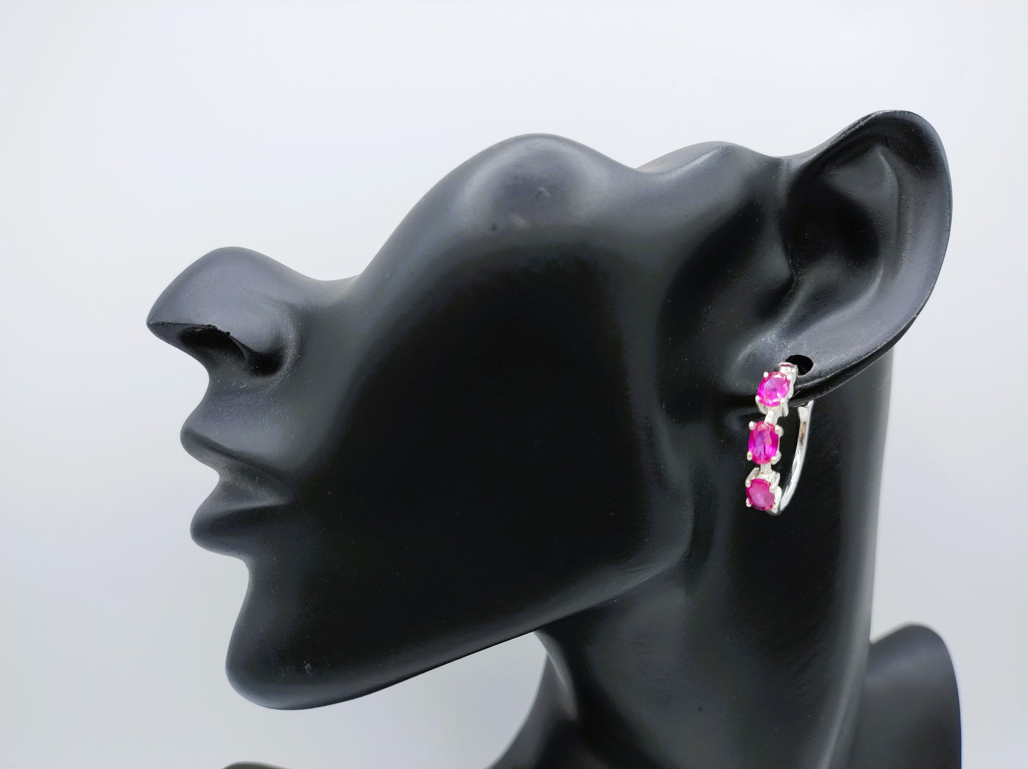 Silver hoop earrings with purple stones