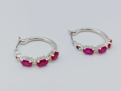 Silver hoop earrings with purple stones