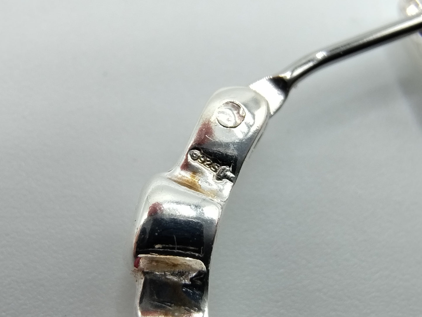 Silver hoop earrings with purple stones