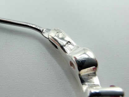 Silver hoop earrings with purple stones