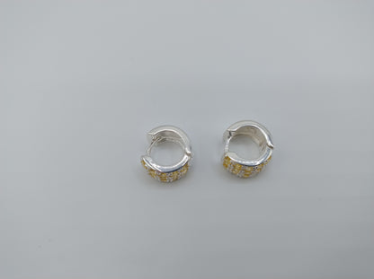 Silver hoop earrings with yellow stones