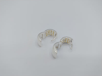 Silver hoop earrings with yellow stones