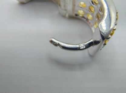 Silver hoop earrings with yellow stones