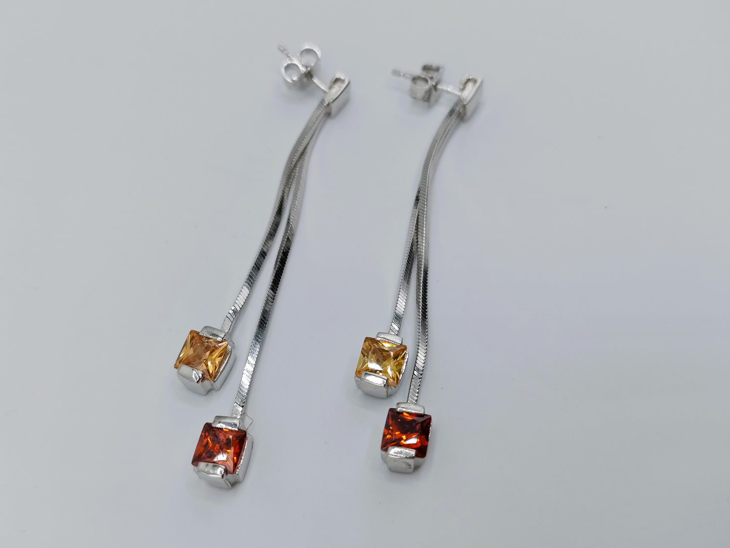 Silver designer earrings, long model