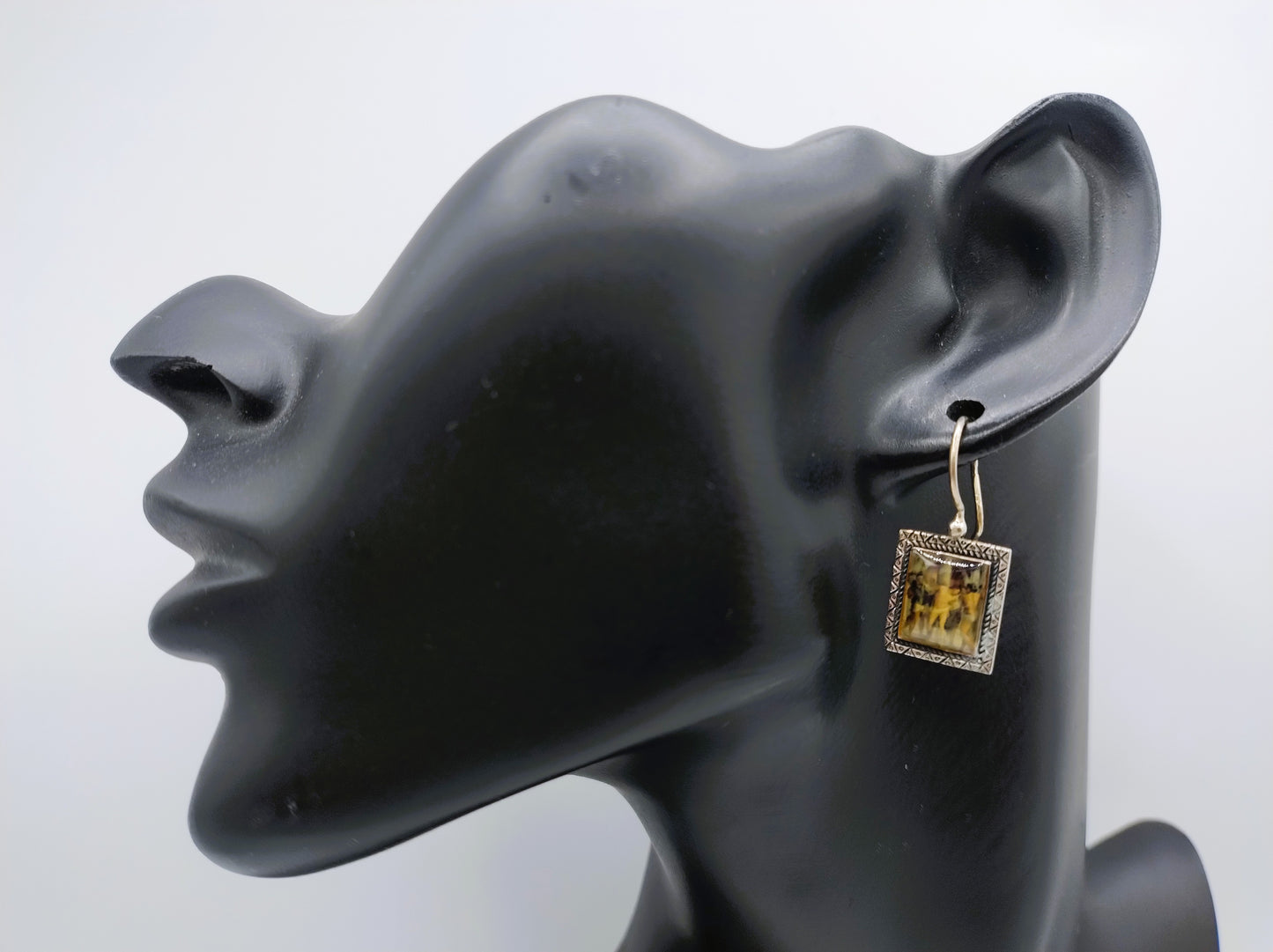 Silver earrings with an image of a painting